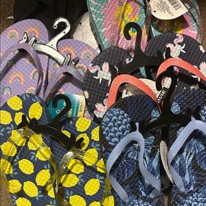 EntireBag$10 or2/$5 Flip Flops with Blue and Yellow multiple Patterns.